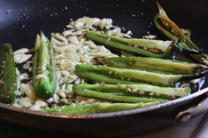 Add garlic to peppers and allow it to lightly fry until golden. Don't let it burn or it'll have a strong, bitter taste and you'll need to start over with fresh garlic. 